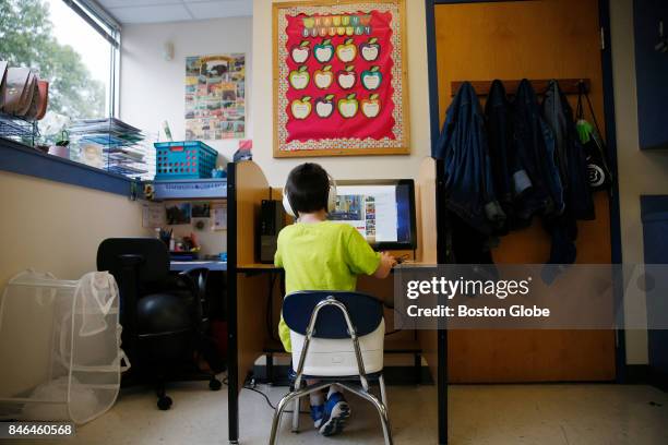 Boy watches "Thomas the Tank Engine" on YouTube as he takes a break during class at the New England Center for Children, a school for children with...