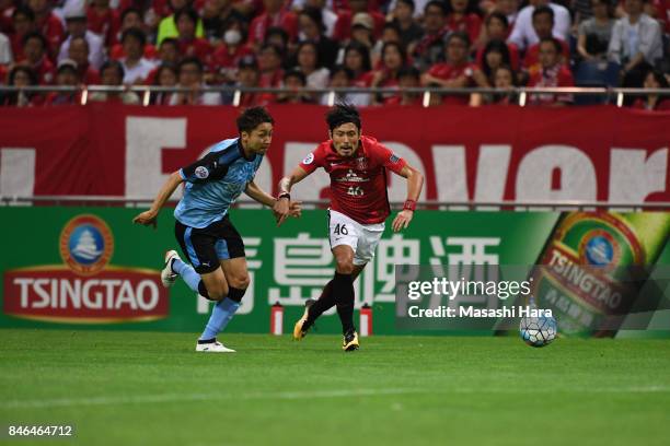 Ryota Moriwaki of Urawa Red Diamonds and Yu Kobayashi of Kawasaki Frontale compete for the ball during the AFC Champions League quarter final second...