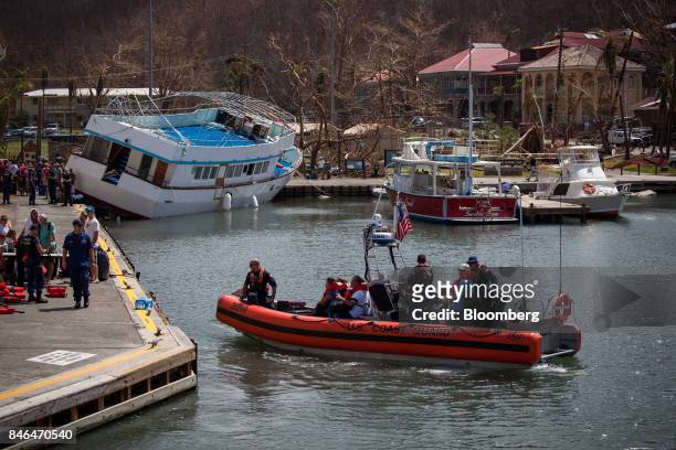 Coast Guard boat evacuates people after Hurricane Irma in St John, U.S. Virgin Islands, on Tuesday, Sept. 12, 2017. After being struck by Irma last...