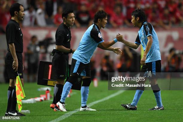 Kengo Nakamura of Kawasaki Frontale is replaced by Yusuke Tasaka during the AFC Champions League quarter final second leg match between Urawa Red...