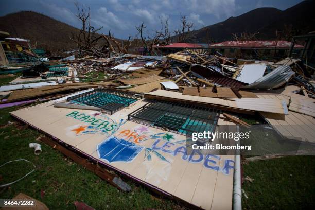 Debris sits in front of a damaged school after Hurricane Irma at Coral Bay in St John, U.S. Virgin Islands, on Tuesday, Sept. 12, 2017. After being...