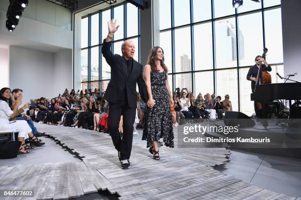 Designer Michael Kors and singer Sara Bareilles walk the runway at the Michael Kors Collection Spring 2018 Runway Show at Spring Studios on September...