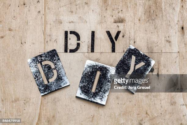 stencils for the letters d, i and y - 3 d letters stock-fotos und bilder