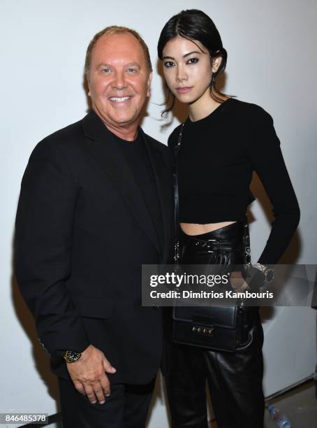 Michael Kors and Hikari Mori pose backstage at Michael Kors Collection Spring 2018 Runway Show at Spring Studios on September 13, 2017 in New York...