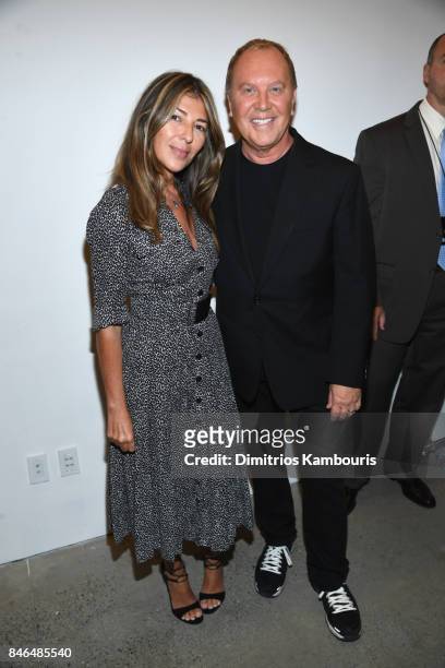 Nina Garcia and Michael Kors pose backstage at Michael Kors Collection Spring 2018 Runway Show at Spring Studios on September 13, 2017 in New York...