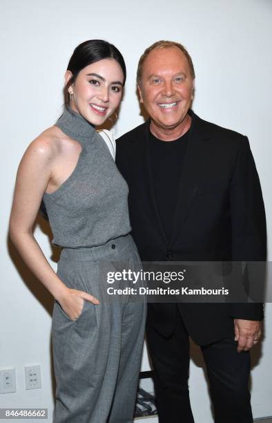 Davika Hoorne and Michael Kors pose backstage at Michael Kors Collection Spring 2018 Runway Show at Spring Studios on September 13, 2017 in New York...