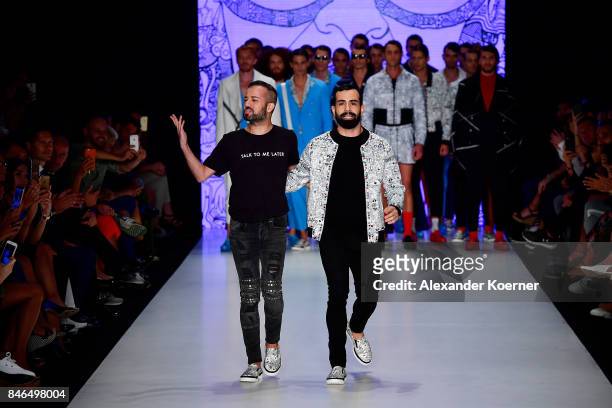 Emre Erdemoglu and Gokhan Turkmen walk the runway at the Emre Erdemoglu show during Mercedes-Benz Istanbul Fashion Week September 2017 at Zorlu...