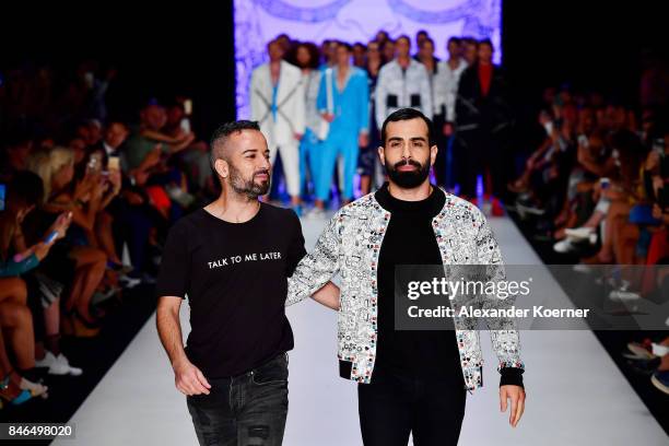 Emre Erdemoglu and Gokhan Turkmen walk the runway at the Emre Erdemoglu show during Mercedes-Benz Istanbul Fashion Week September 2017 at Zorlu...