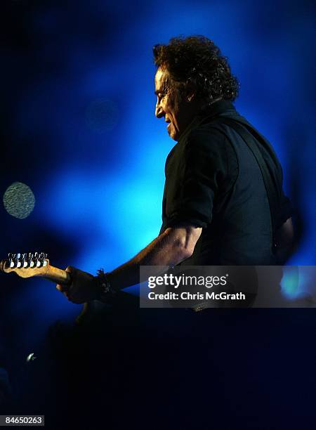 Musician Bruce Springsteen and the E Street Band perform at the Bridgestone halftime show during Super Bowl XLIII between the Arizona Cardinals and...