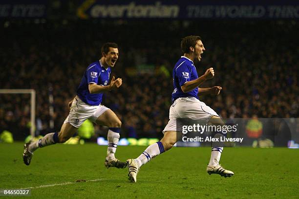 Dan Gosling of Everton celebrates after scoring the winning goal during the FA Cup fourth round replay match sponsored by e.on between Everton and...