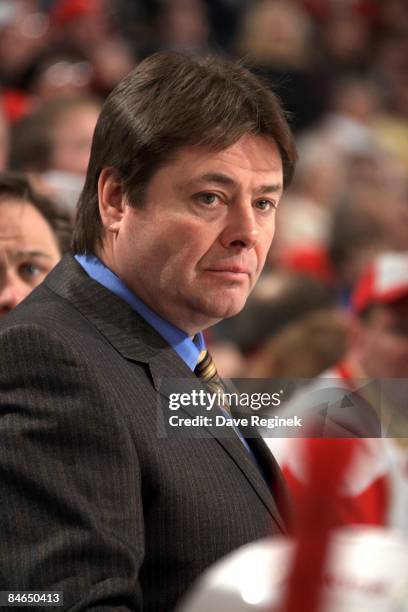 Assistant coach Brad McCrimmon of the Detroit Red Wings watches the play from bench during a NHL game against the St. Louis Blues on February 2, 2009...