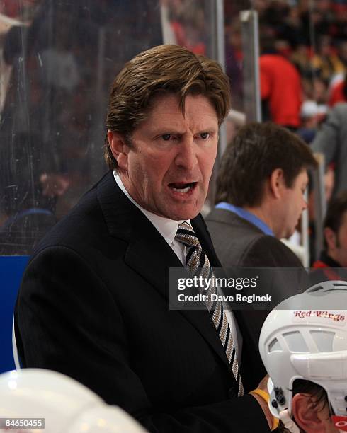 Head coach Mike Babcock of the Detroit Red Wings instructs his team from bench during a NHL game against the St. Louis Blues on February 2, 2009 at...