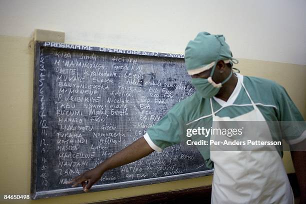 Dr. Denis Mukwege, a French trained gynecologist, looks at the board of today's scheduled operations on November 2, 2007 in Panzi hospital in Bukavu,...