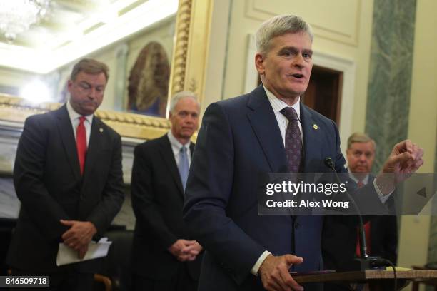 Sen. Bill Cassidy speaks as Sen. Dean Heller , Sen. Ron Johnson and Sen. Lindsey Graham listen during a news conference on health care September 13,...