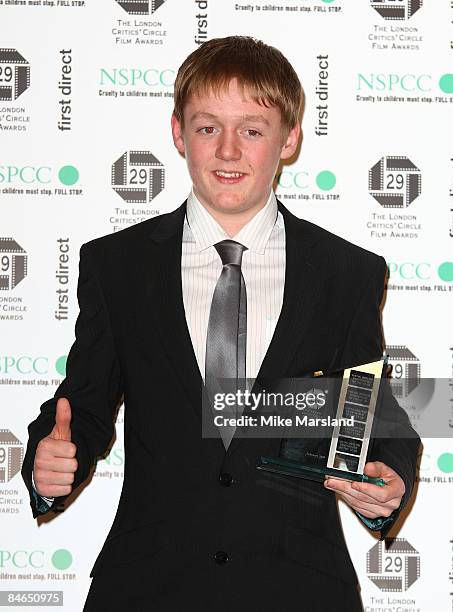 Actor Thomas Turgoose holds his NSPCC award - young British performer of the year at The 29th Annual London Critics' Circle Film Awards at Grosvenor...