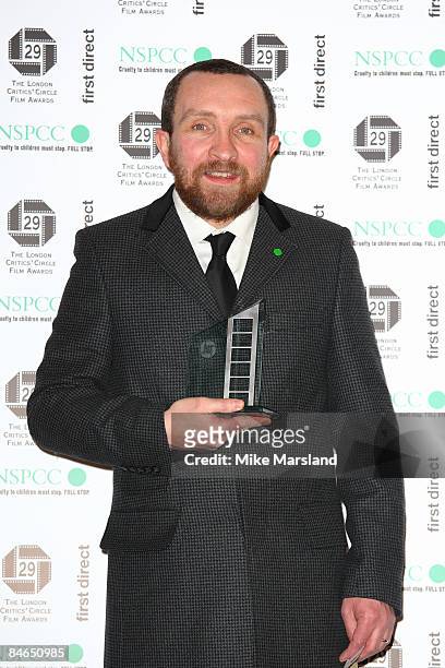 Eddie Marsan hold his award for British Actor in a Supporting role at The 29th Annual London Critics' Circle Film Awards at Grosvenor House Hotel on...