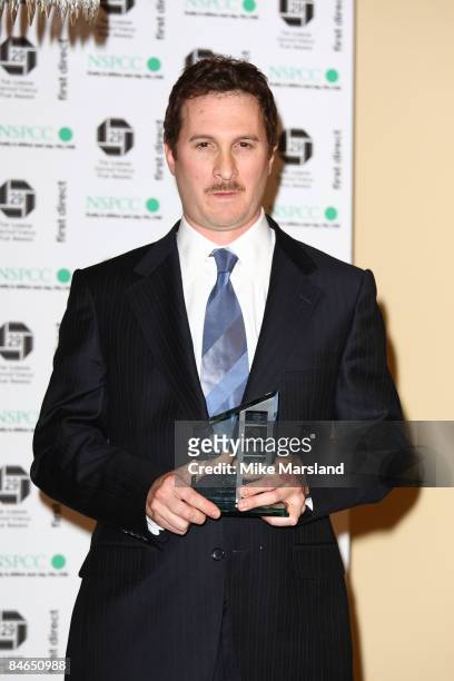 Darren Aronofsky holds his award for Director of the Year at The 29th Annual London Critics' Circle Film Awards at Grosvenor House Hotel on February...