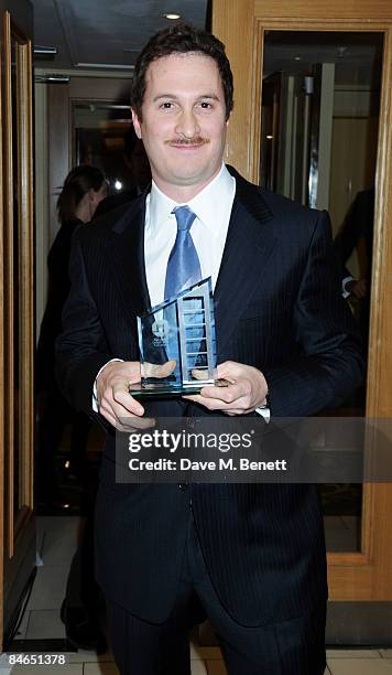 Darren Aronofsky poses in the winners room with the award for Director of the Year during the London Critics' Circle Film Awards 2009, at the...