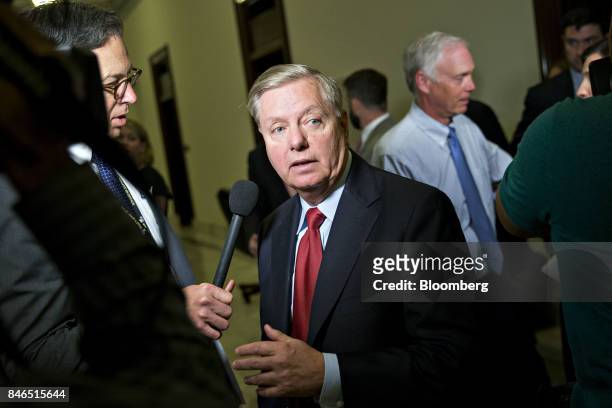 Senator Lindsey Graham, a Republican from South Carolina, walks away after a television interview following a news conference to reform health care...