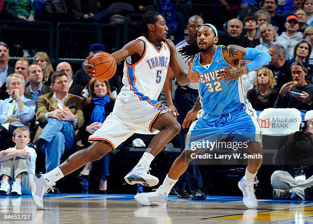 Kyle Weaver of the Oklahoma City Thunder goes to the basket against Renaldo Balkman of the Denver Nuggets at the Ford Center on February 4, 2009 in...