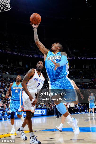 Smith of the Denver Nuggets goes to the basket against Joe Smith of the Oklahoma City Thunder at the Ford Center on February 4, 2009 in Oklahoma...