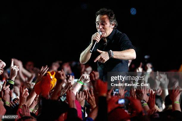 Musician Bruce Springsteen and the E Street Band perform at the Bridgestone halftime show during Super Bowl XLIII between the Arizona Cardinals and...