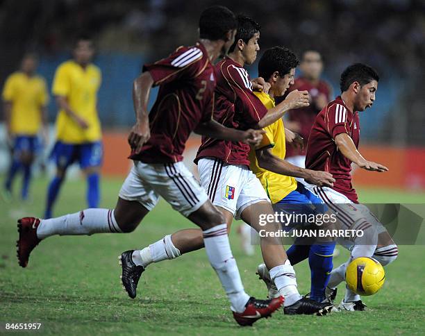 Venezuelans Jose Velazquez , Carlos Salazar and Francisco Fajardo vie for the ball with Brazilian Maylson during their South American U-20 football...