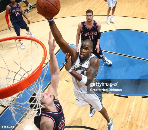 Antawn Jamison of the Washington Wizards shoots against Ryan Anderson of the New Jersey Nets at the Verizon Center on February 4, 2009 in Washington,...