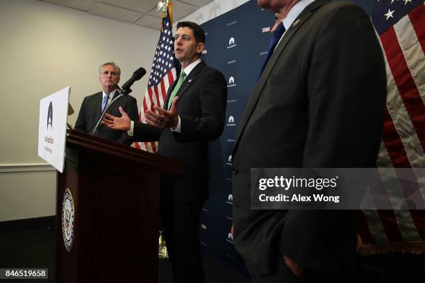 Speaker of the House Rep. Paul Ryan speaks as House Majority Leader Rep. Kevin McCarthy listens during a news briefing September 13, 2017 at the...