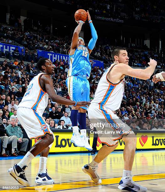 Carmelo Anthony of the Denver Nuggets shoots a jump shot against Jeff Green of the Oklahoma City Thunder at the Ford Center on February 4, 2009 in...