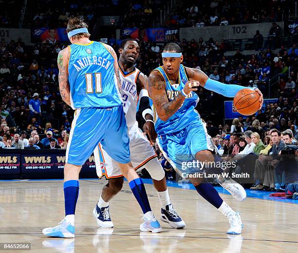 Carmelo Anthony of the Denver Nuggets goes to the basket against Jeff Green of the Oklahoma City Thunder at the Ford Center on February 4, 2009 in...