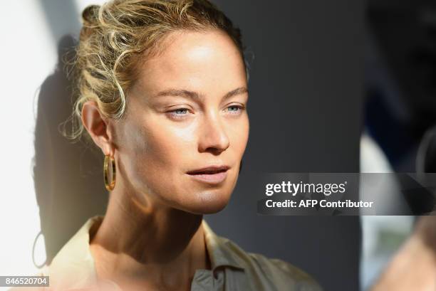 Model Carolyn Murphy is photographed backstage at Michael Kors Collection Spring 2018 Runway Show at Spring Studios on September 13 during New York...