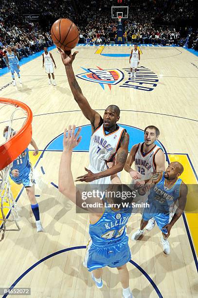 Joe Smith of the Oklahoma City Thunder goes to the basket against Linas Kleiza of the Denver Nuggets at the Ford Center on February 4, 2009 in...