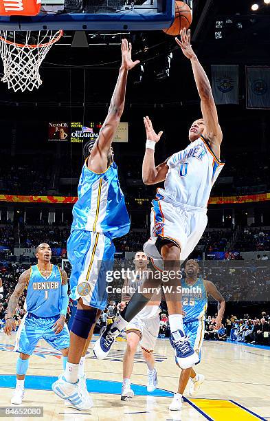Russell Westbrook of the Oklahoma City Thunder goes to the basket against Nene of the Denver Nuggets at the Ford Center on February 4, 2009 in...