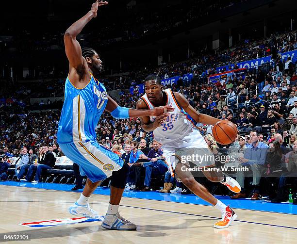 Kevin Durant of the Oklahoma City Thunder goes to the basket against Nene of the Denver Nuggets at the Ford Center on February 4, 2009 in Oklahoma...