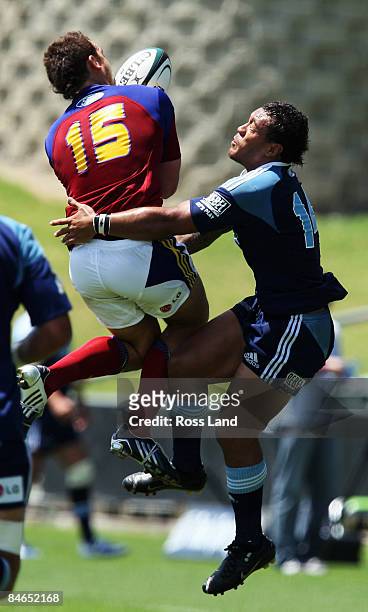 Anthony Tuitavake of the Blues and Israel Dagg of the Highlanders compete for high ball during a Super 14 pre-season match between the Blues and the...