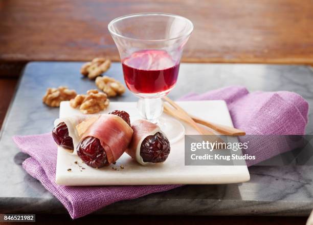 prosciutto wrapped dates - prosciutto wrapped stock pictures, royalty-free photos & images