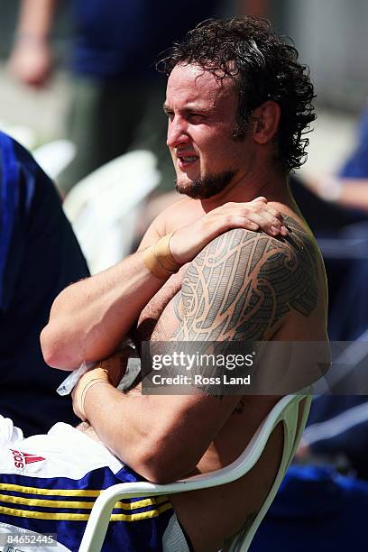 Josh Bekhuis of the Highlanders soaks up the sun on the sideline during a Super 14 pre-season match between the Blues and the Highlanders held at...