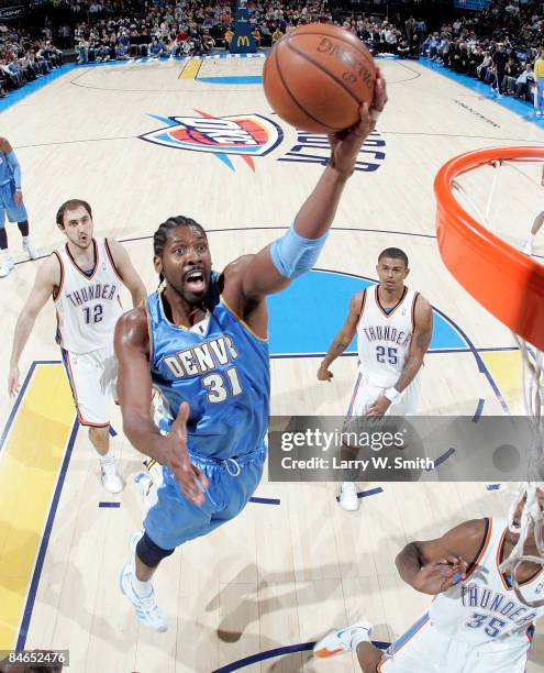 Nene of the Denver Nuggets goes to the basket against the Oklahoma City Thunder at the Ford Center on February 4, 2009 in Oklahoma City, Oklahoma....