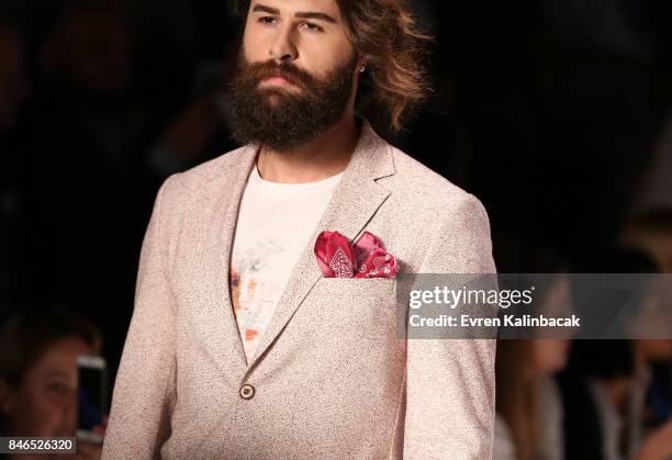 Model walks the runway at the Giovane Gentile show during Mercedes-Benz Istanbul Fashion Week September 2017 at Zorlu Center on September 13, 2017 in...