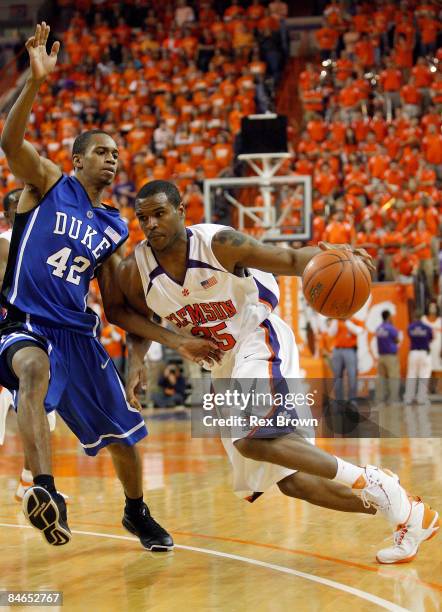 Trevor Booker of the Clemson Tigers works to drive past Lance Thomas of the Duke Blue Devils during the second half at Littlejohn Coliseum on...