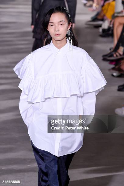 Xiao Wen Ju walks the runway at the 3.1 Phillip Lim Ready to Wear Spring/Summer 2018 fashion show during New York Fashion Week on September 11, 2017...