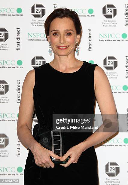 Actress Kristen Scott Thomas holds her Award for Best British Actress in a supporting role at The 29th Annual London Critics' Circle Film Awards at...