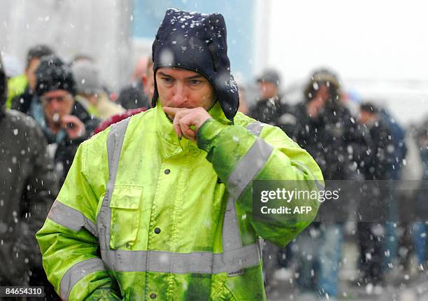 Workers leave a union meeting at the Total Lindsey Oil Refinery in Immingham, Lincolnshire, on February 5, 2009. Workers at an oil refinery in...