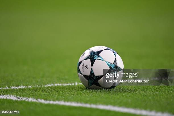 The official UEFA football sits on the pitch before the UEFA Champions League football match Real Madrid CF vs APOEL FC at the Santiago Bernabeu...