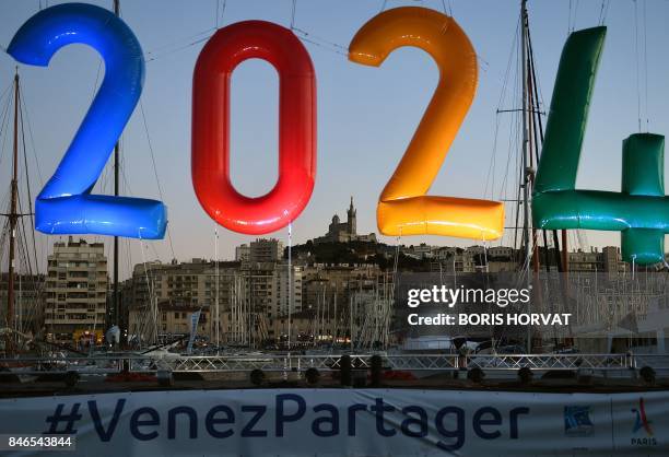 An inflatable '2024' logo is seen in the old harbour area of Marseille late September 13 during celebrations after the International Olympic...