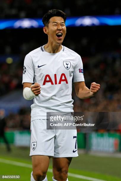 Tottenham Hotspur's South Korean striker Son Heung-Min celebrates after scoring the opening goal of the UEFA Champions League Group H football match...