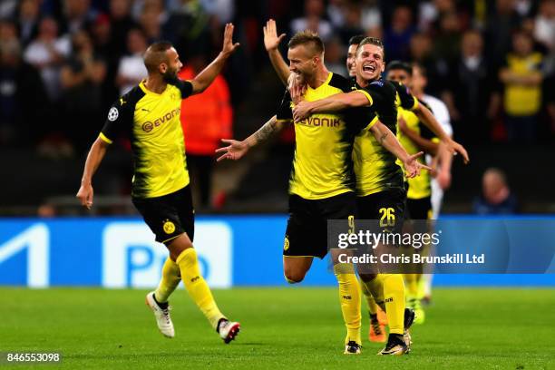 Andrey Yarmolenko of Borussia Dortmund is congratulated by team mates after scoring his sides first goal during the UEFA Champions League group H...
