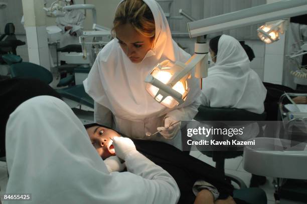 Female dentistry students at Tehran's Azad University, wearing white Islamic outfits, 7th January 2004.