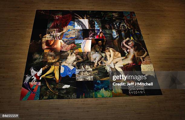 Edinburgh art college student Hannah Knight, stands beside a large-scale reproduction of Titian�s masterpiece Diana and Actaeon on February 5, 2009...